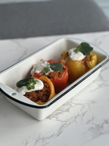 Oven-baked bell peppers with soy & walnut "meat"